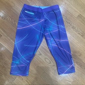 Bright neon colored Puma work out cropped pants